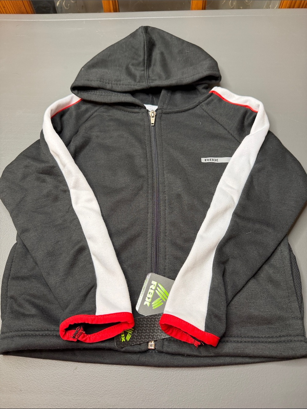 Kid’s Black full-zip Hoodie with White & Red Accents. NWT. Size: 4T